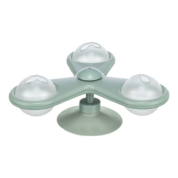 Green silicone ice cube tray with four round compartments on a white background